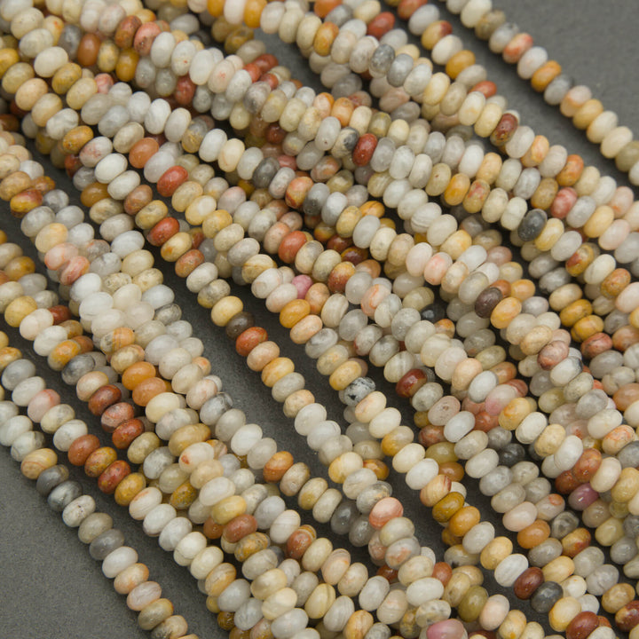 Close-up of multicolored seed beads on a dark background