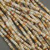 Close-up of multicolored seed beads on a dark background