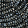 Close-up of dark blue faceted beads