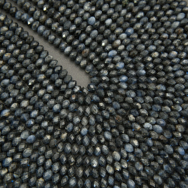 Close-up of a textured black surface with small raised beads