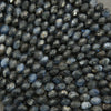Close-up of dark blue faceted beads