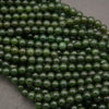 Close-up of green beads on a gray background