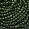 Close-up of green beads stacked together