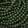 Close-up of green beads stacked together