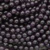 Close-up of purple beads with a blurred background