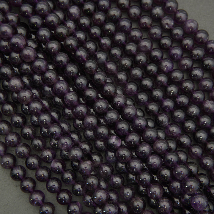Close-up of purple amethyst on a gray background