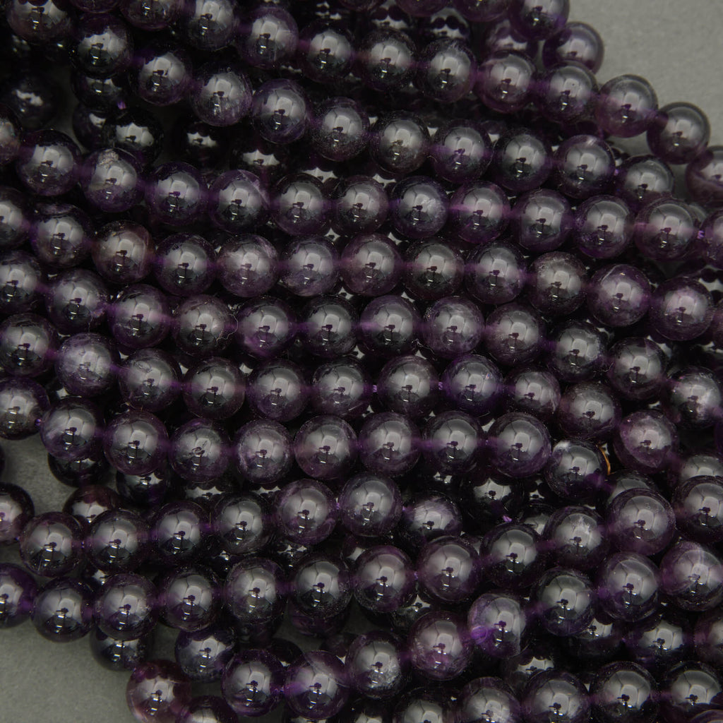 Close-up of purple beads on a gray background