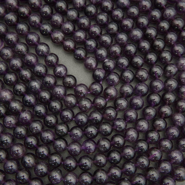 Close-up of purple beads arranged in a circular pattern