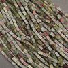 Small rectangular Dragon Blood Jasper gemstone beads in olive green, burgundy, and rusty red shades.