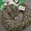 Close-up of Dragon Blood Jasper beads displaying contrasting forest green and brick-red mineral patterns.