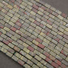 Strands of Dragon Blood Jasper rectangular tube beads with unique red and green coloration.