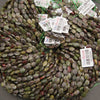 A bundle of faceted dragon's blood jasper oval bead strands with Tejas Beads tags