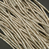 Close-up of beige decorative sticks on a dark background