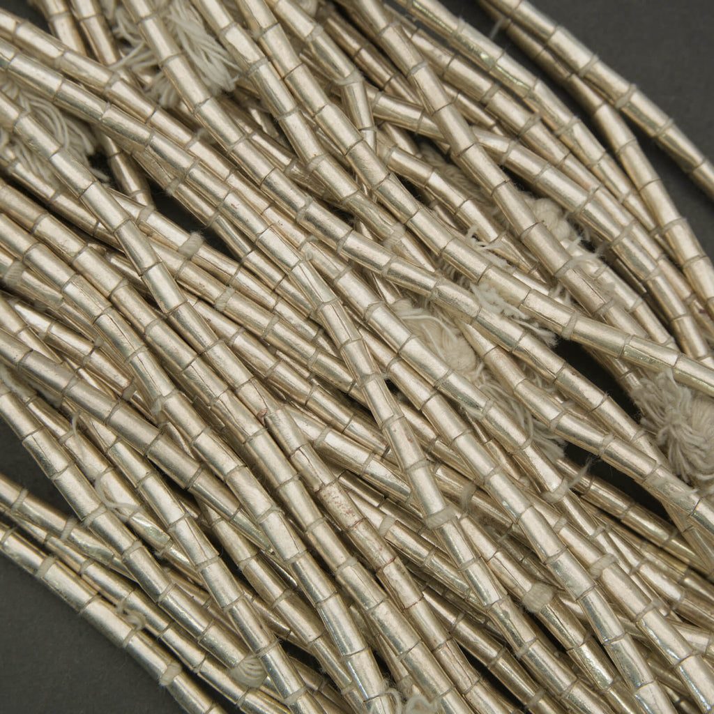 Close-up of beige decorative sticks on a dark background