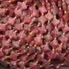 Faceted strawberry quartz clover beads in soft pink and berry tones with gold spacer beads.