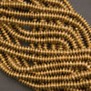 Brass disc beads, thin heishi style with spiked profile and satin metallic finish

