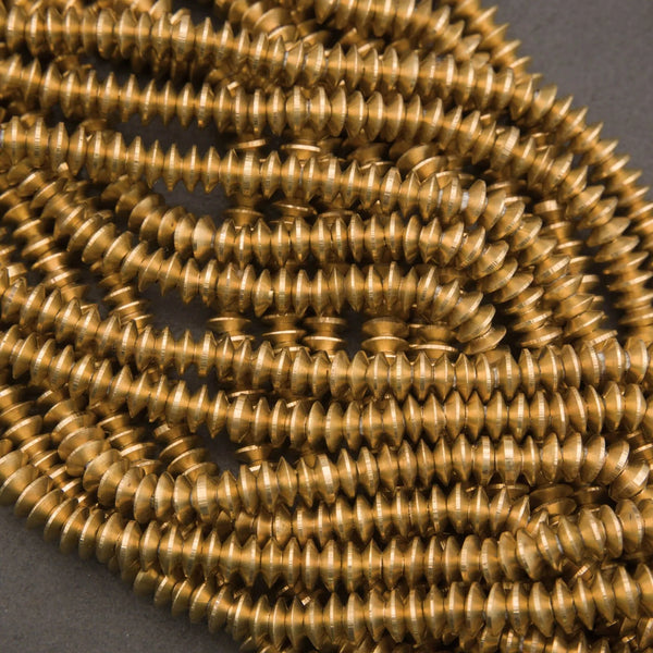 Brass disc beads, thin heishi style with spiked profile and satin metallic finish

