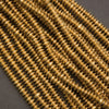 Ethiopian brass heishi beads, stacked disc spacers with warm gold tone and textured edges