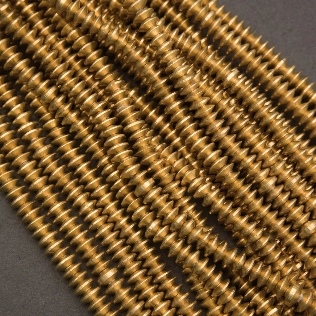 Ethiopian brass heishi beads, stacked disc spacers with warm gold tone and textured edges
