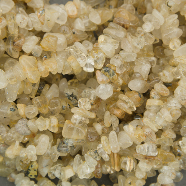 Close-up of small, beige-colored stones or pebbles.