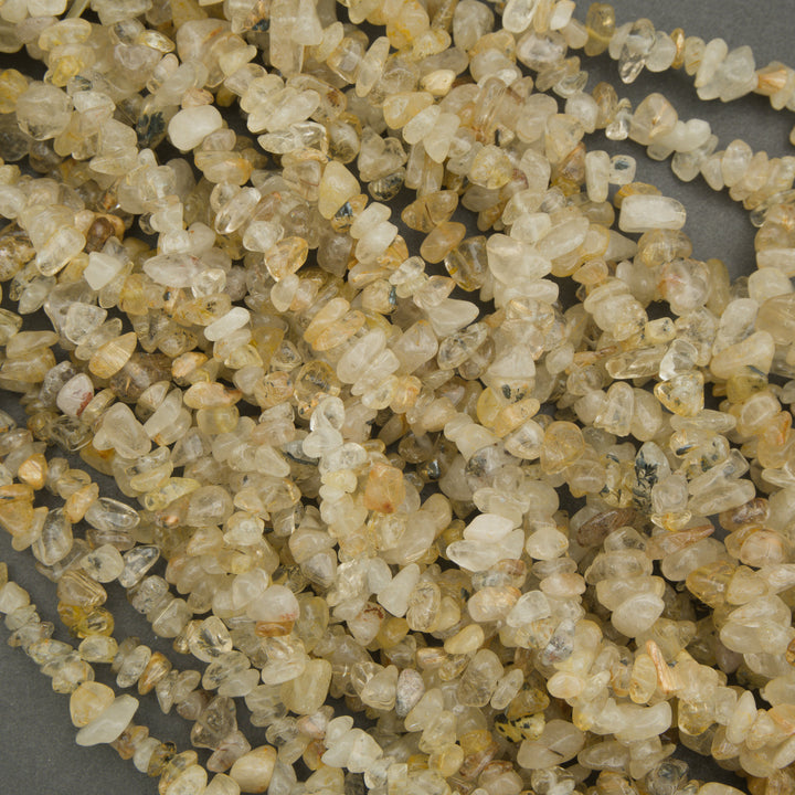 Close-up of small, multicolored stones on a gray background
