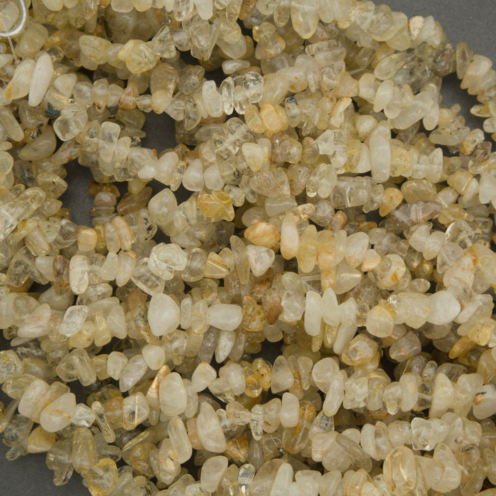 Close-up of small, rough stones with a neutral color palette.