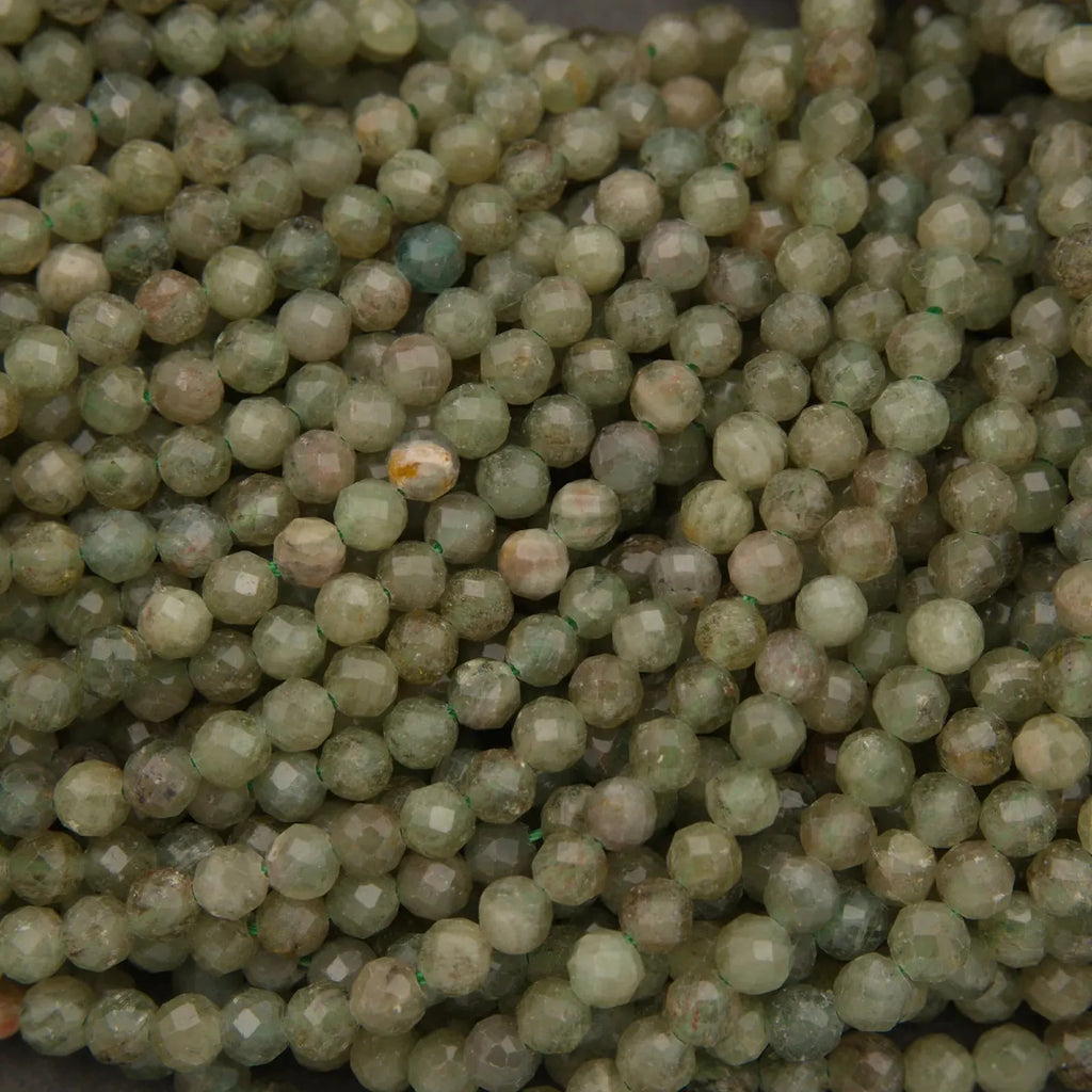 Close-up of green beads on a dark background