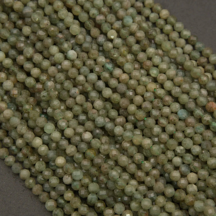 Close-up of green beads on a dark background