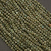 Close-up of green beads on a dark background