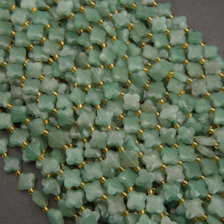 Natural green aventurine gemstone beads featuring four-petal floral shapes and a frosted finish.