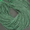 Translucent green aventurine beads rondelle cut gemstone strand close up