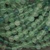 Close-up of green beads on a string