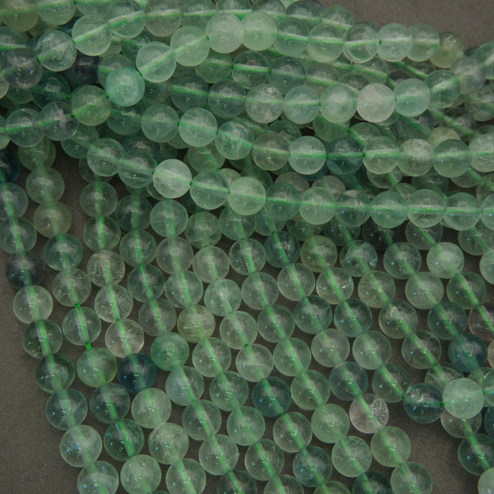 Close-up of green beads on a dark background