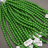 Half strands of smooth round green jade large hole beads with Tejas Beads tags
