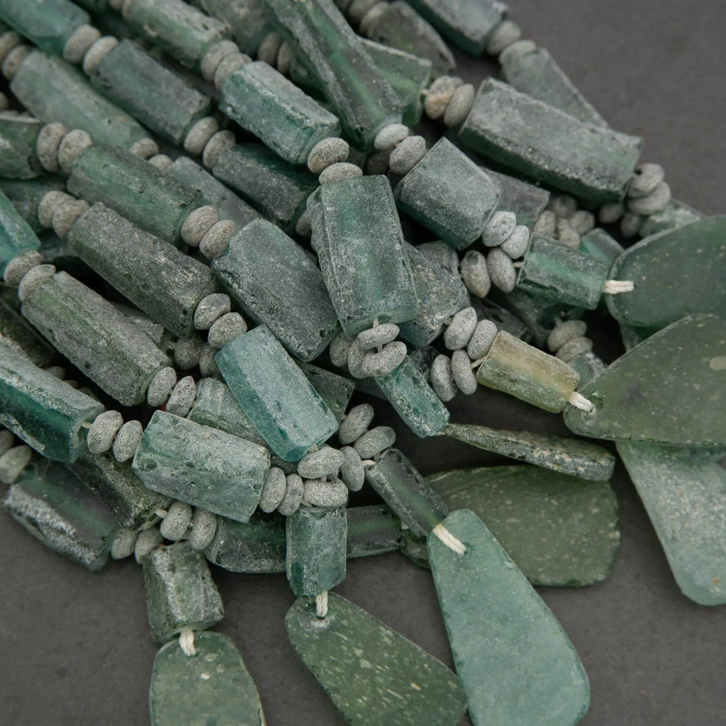 Green beads on a dark gray background