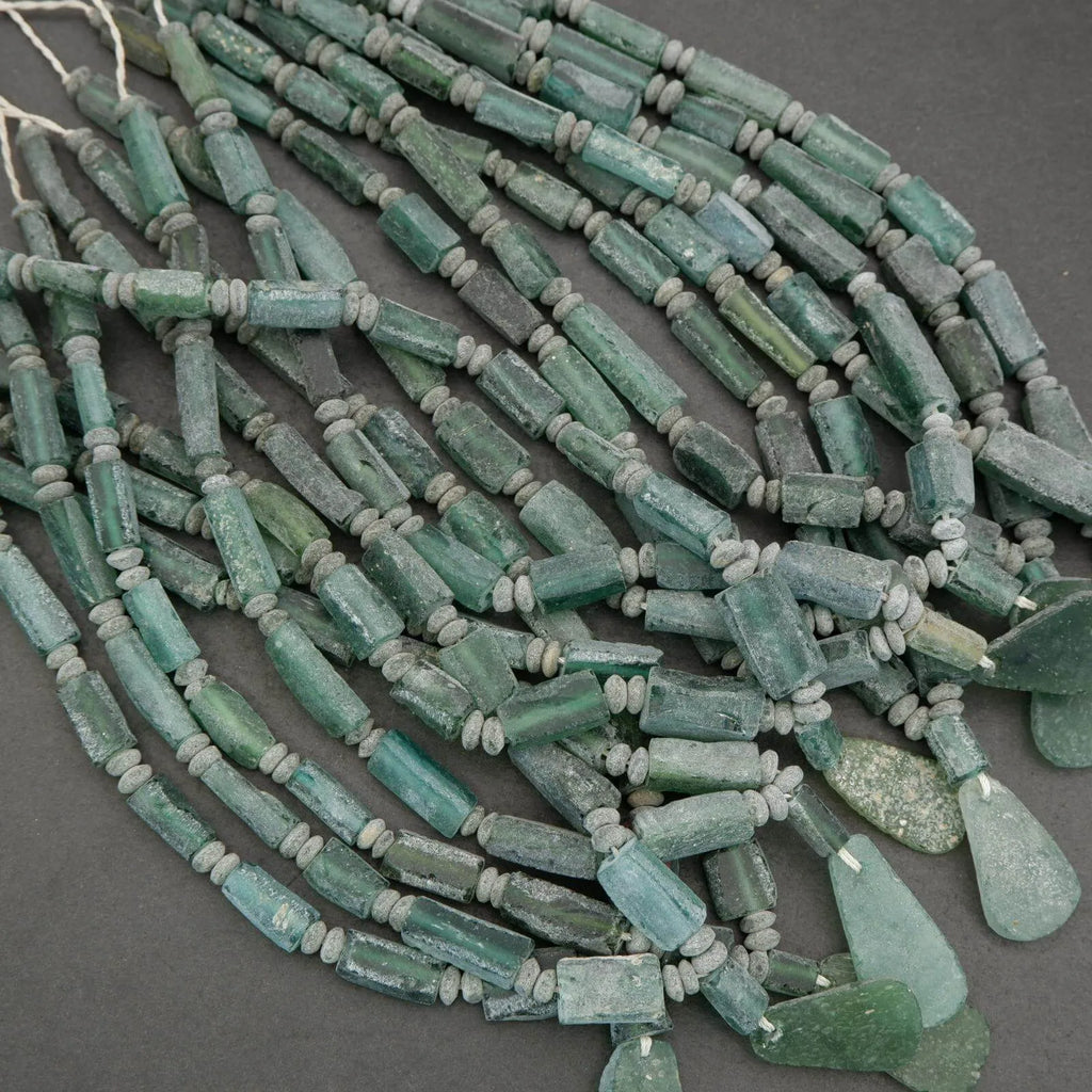 String of green beads on a gray background