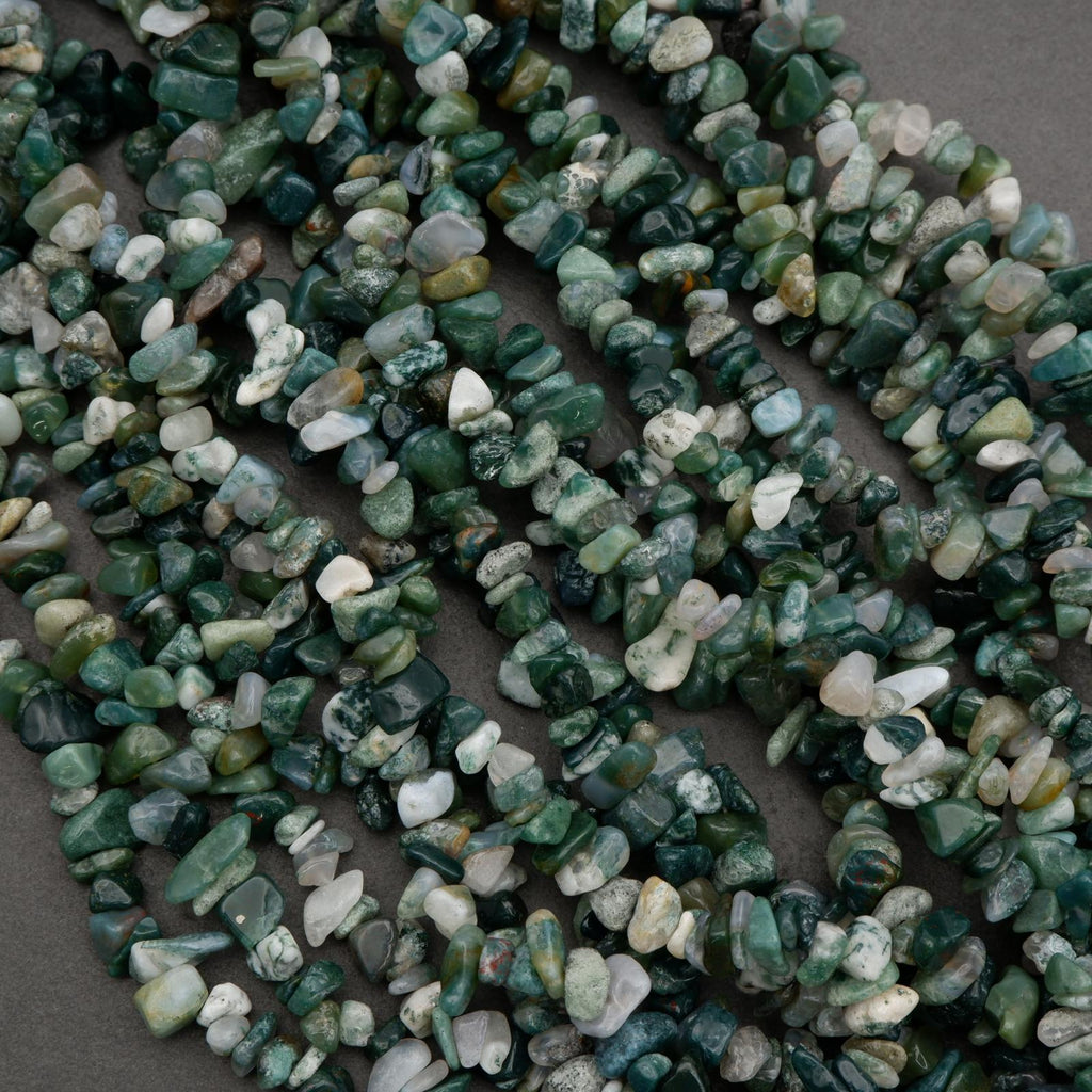 Close-up of green and white stone chips on a dark background