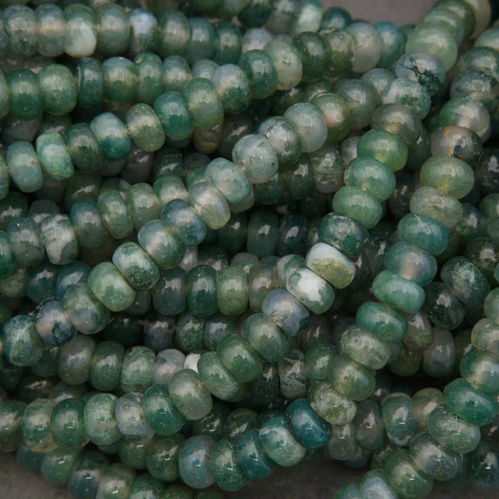 Close-up of green beads on a dark background