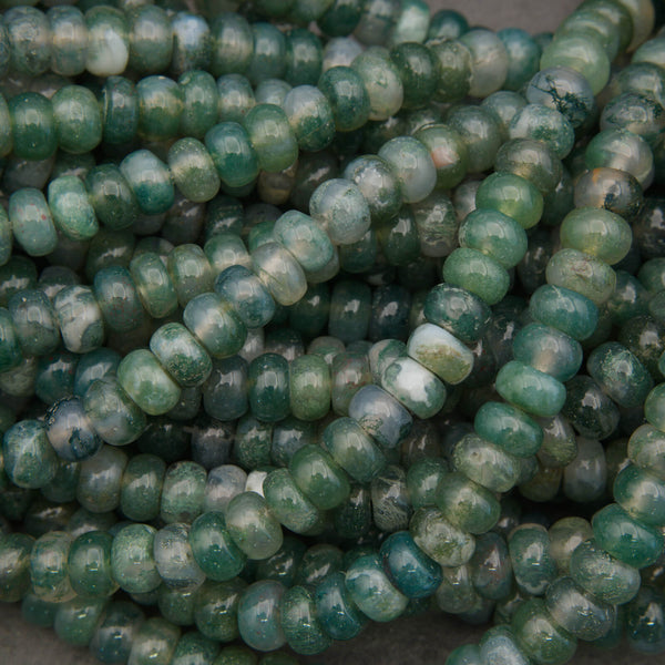 Close-up of green beads on a dark background
