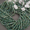 Moss agate gemstone beads, rondelle shape with mixed green and cloudy inclusions