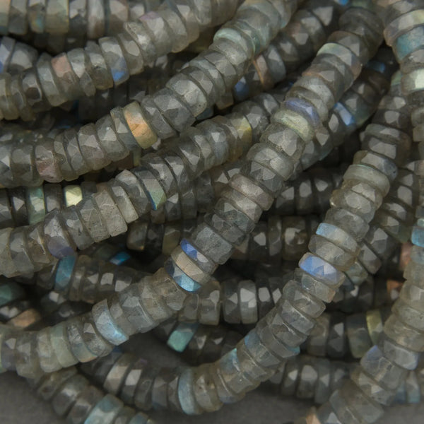 Close-up of a string of dark gray beads with blue highlights