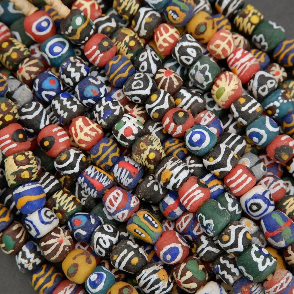 Assorted colorful beads with various patterns on a gray background