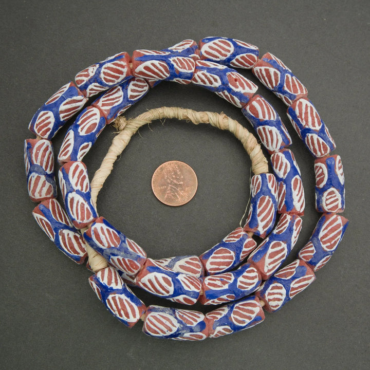 Beaded necklace with blue and red pattern on a dark gray background