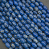 Close-up of blue beads on a dark background