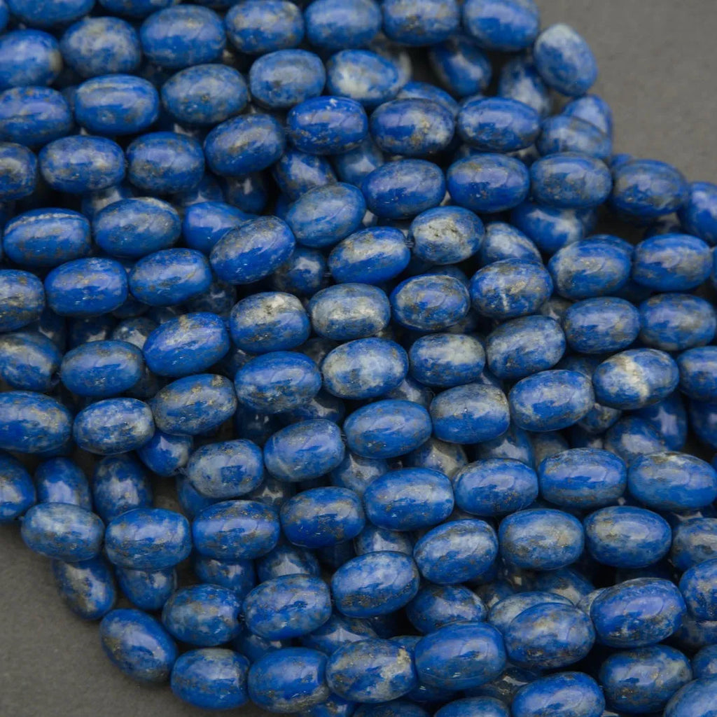 Close-up of blue oval beads on a gray background
