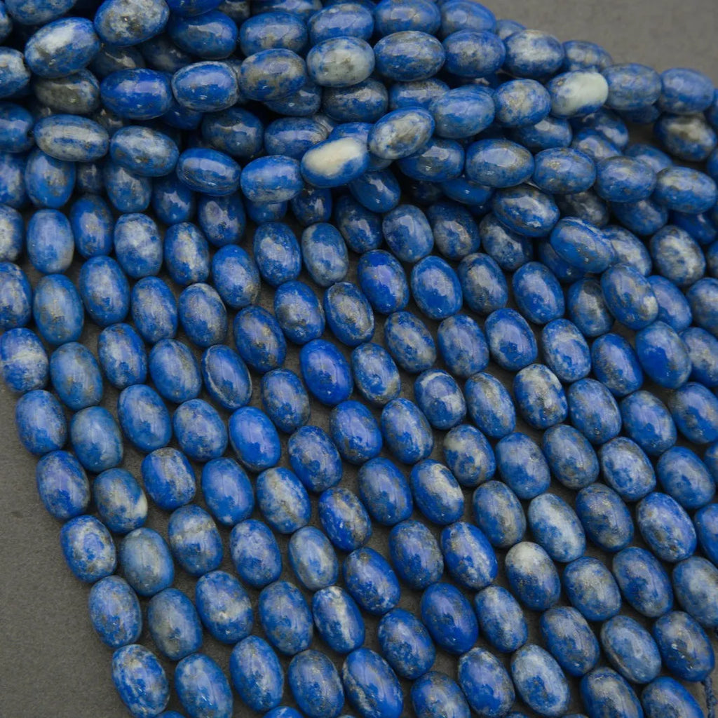Close-up of blue beads on a dark surface