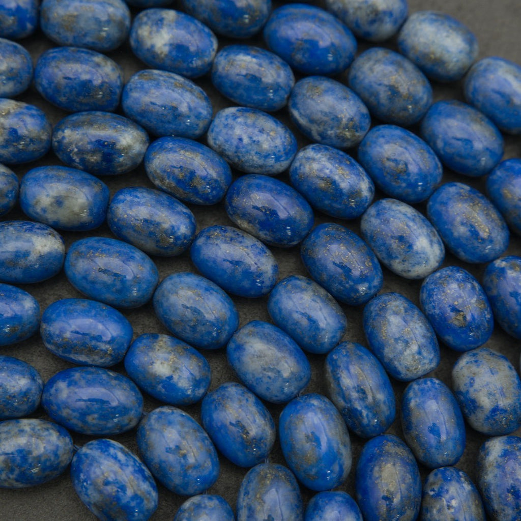 Close-up of blue oval beads on a dark background