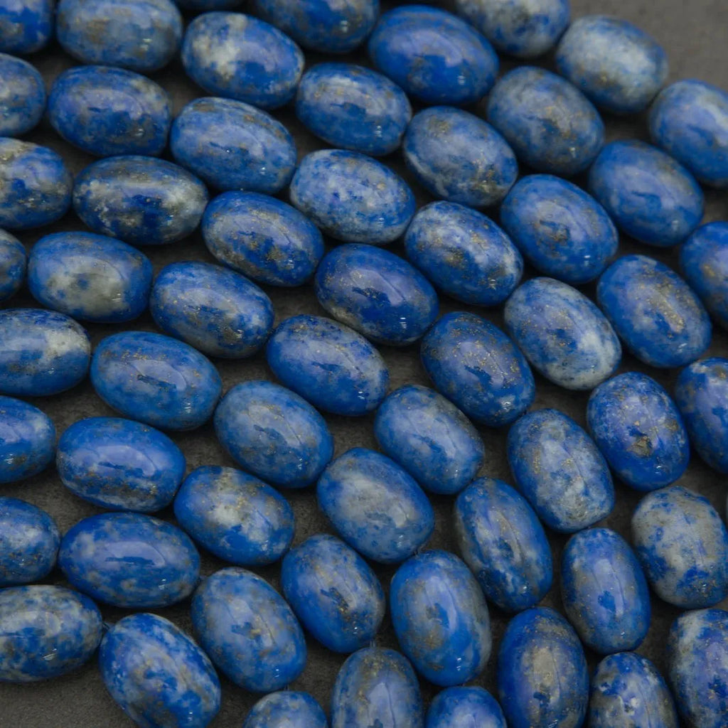 Close-up of blue oval beads on a dark background