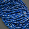 Close-up of blue cylindrical beads on a gray background