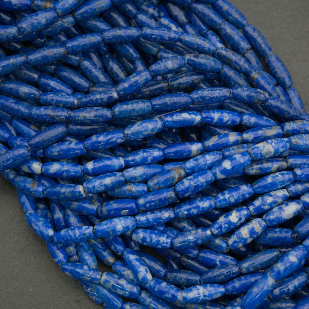 Close-up of blue cylindrical beads on a gray background